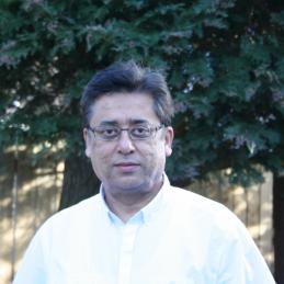 Headshot of Dr Sharma